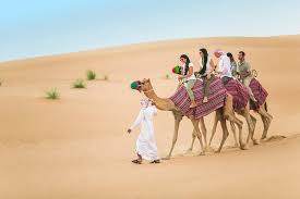 ATV riding experience as part of a desert safari in Dubai across red sand dunes