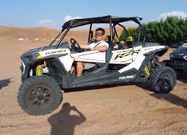 Desert safari in Dubai featuring dune buggy rides across golden sand dunes