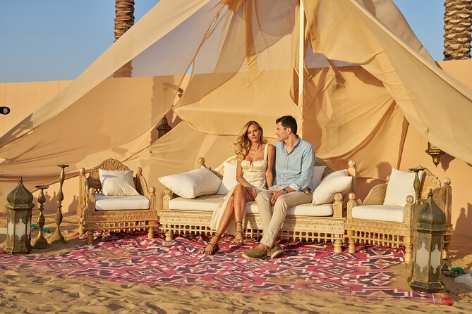 Private desert camp with tents and dunes in Dubai